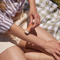 Relief Balm Anti-Itch Remedy -Beauty Essence Shop 2 Kinfield Relief Balm Applying Zoomed